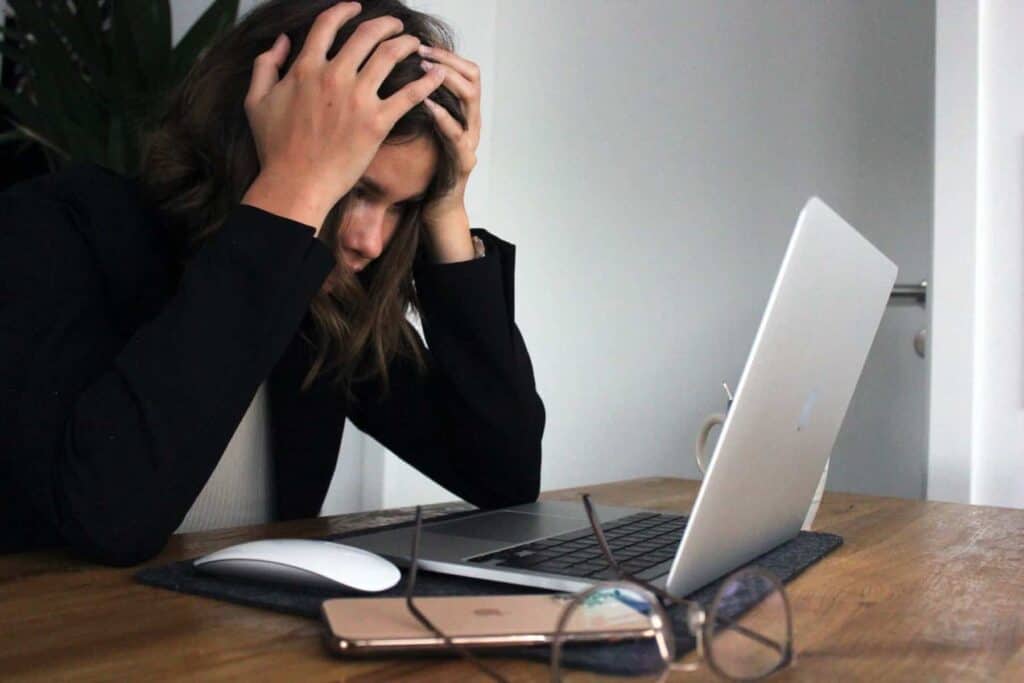business woman frustrated at her clutter computer